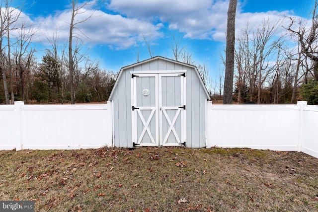 view of shed with a fenced backyard