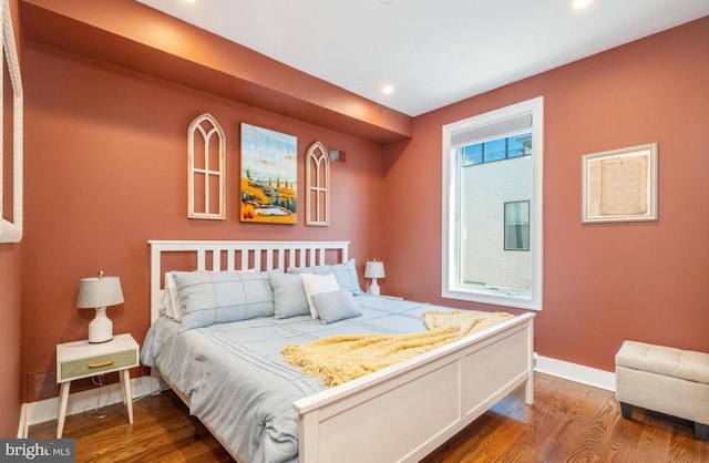 bedroom featuring recessed lighting, baseboards, and wood finished floors