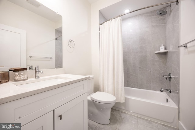 bathroom with toilet, shower / bath combo, and vanity