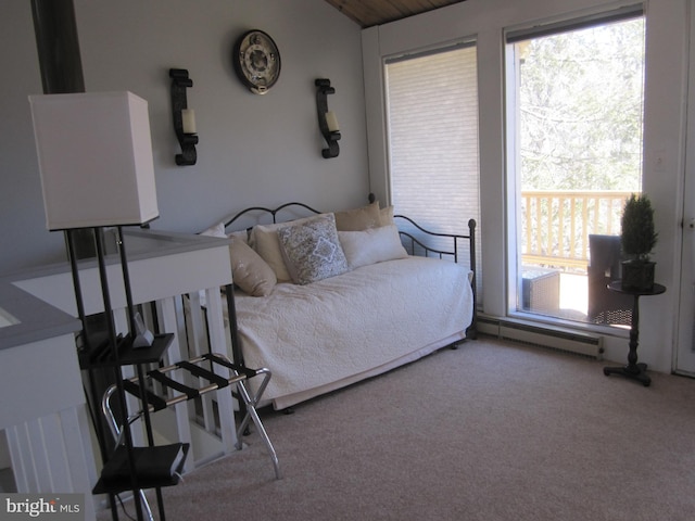 carpeted bedroom with lofted ceiling and a baseboard radiator