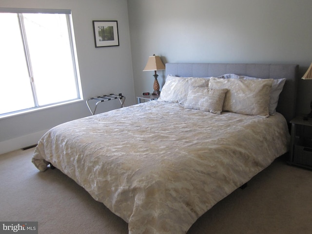 bedroom with carpet flooring and visible vents