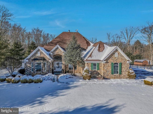 view of front of home with stone siding