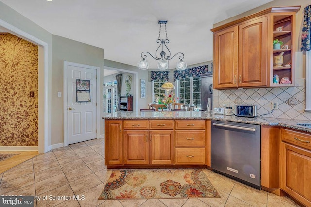 kitchen featuring light stone counters, light tile patterned flooring, dishwasher, and a peninsula