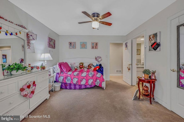 bedroom with ceiling fan, visible vents, and carpet flooring