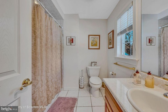 full bathroom featuring tile patterned flooring, a shower with curtain, vanity, and toilet