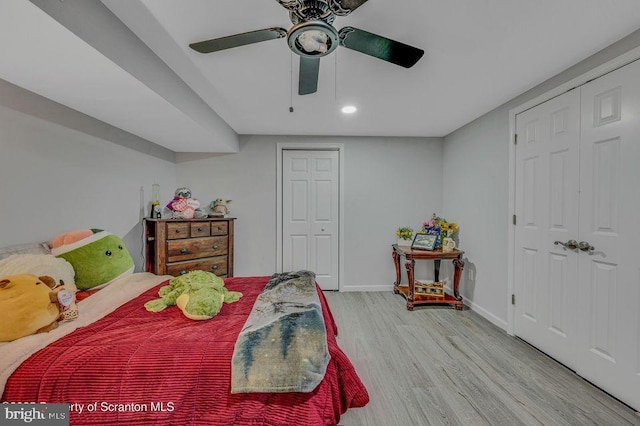 bedroom featuring a ceiling fan, baseboards, wood finished floors, and recessed lighting