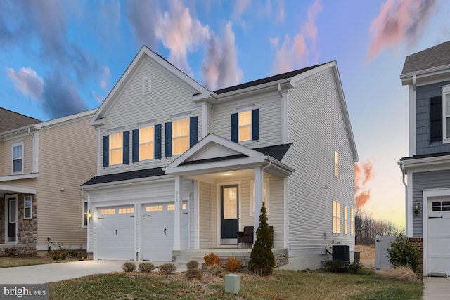 view of front of property with a porch, cooling unit, driveway, and an attached garage