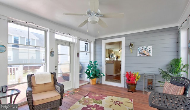 sunroom / solarium with ceiling fan