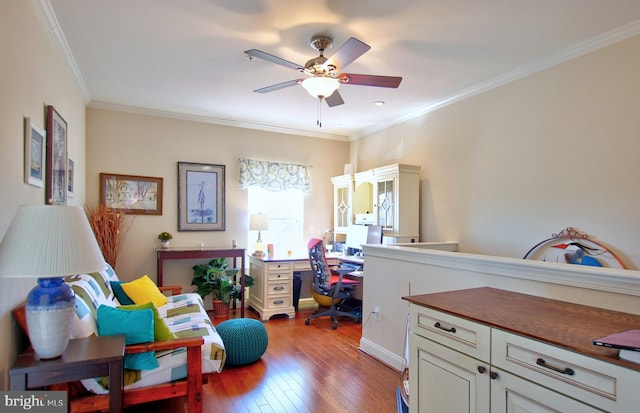 office area featuring crown molding, a ceiling fan, and hardwood / wood-style flooring