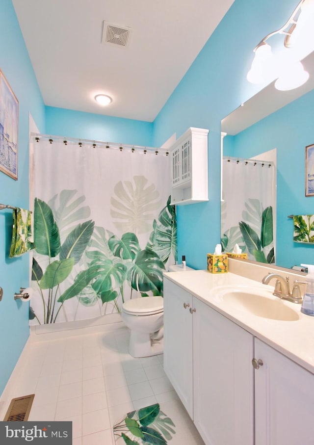 full bath featuring vanity, tile patterned floors, toilet, and visible vents