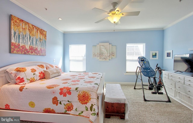 bedroom featuring multiple windows, carpet floors, baseboards, and crown molding