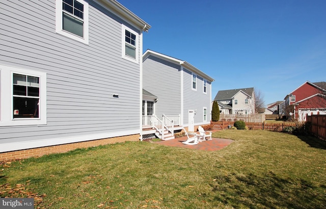 view of yard with a residential view, a patio, and fence