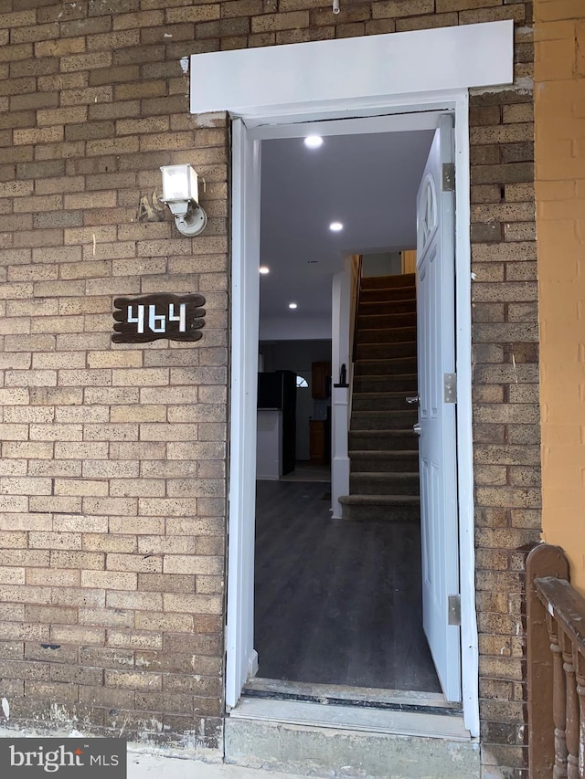 property entrance with brick siding