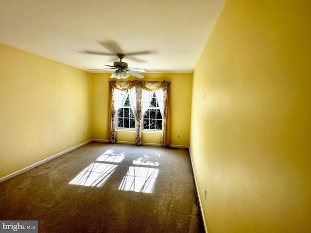 empty room featuring ceiling fan, baseboards, and carpet floors