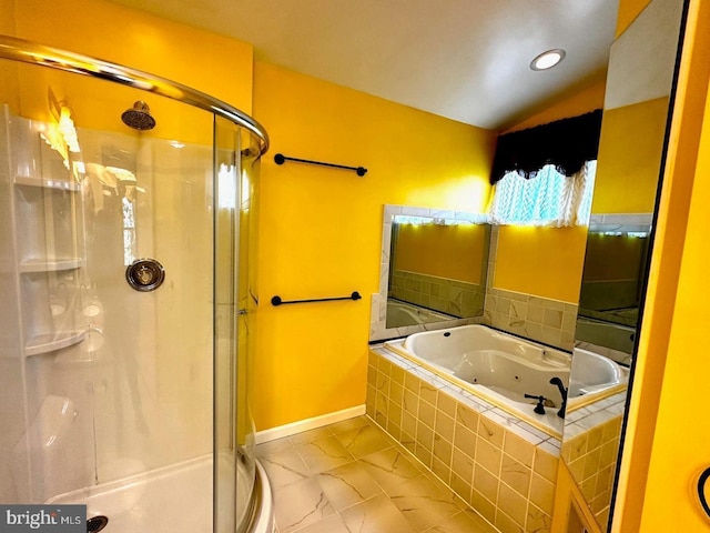 full bath with marble finish floor, a stall shower, a jetted tub, baseboards, and vaulted ceiling