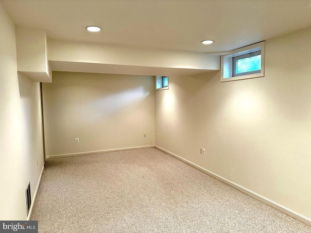 below grade area with recessed lighting, baseboards, and carpet floors