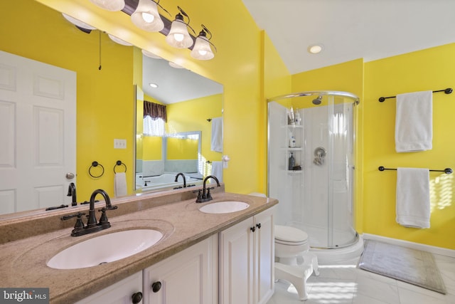 full bathroom featuring a shower stall, double vanity, and a sink