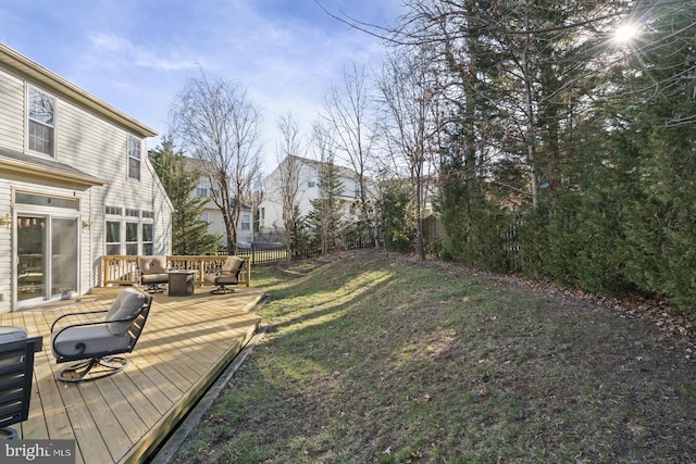 view of yard with fence and a wooden deck