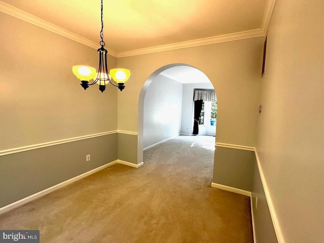 interior space with arched walkways, baseboards, carpet floors, and ornamental molding