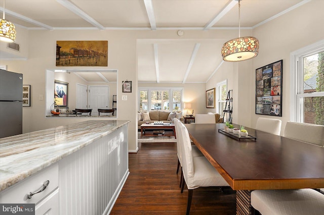 dining room with lofted ceiling with beams, visible vents, plenty of natural light, and dark wood-style floors