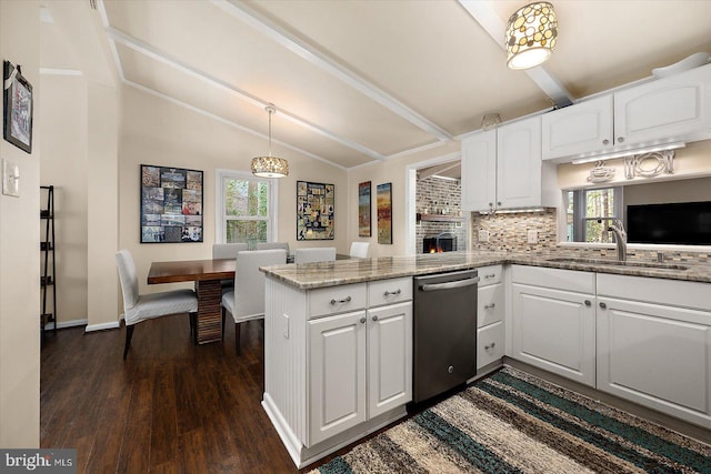 kitchen featuring light stone countertops, a peninsula, lofted ceiling with beams, white cabinets, and stainless steel dishwasher