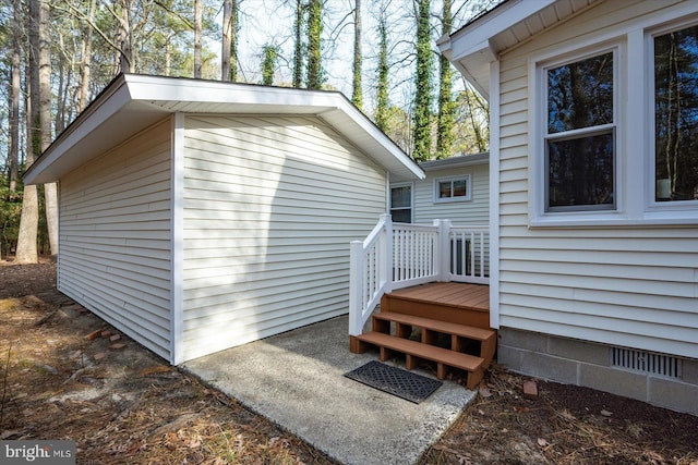 view of property exterior featuring crawl space and an outdoor structure