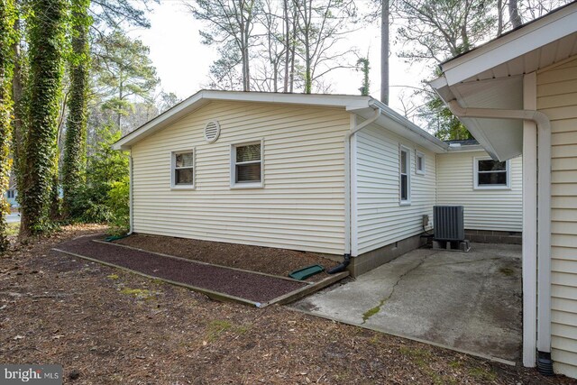 view of side of property featuring central AC unit