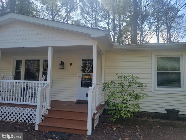 property entrance featuring covered porch