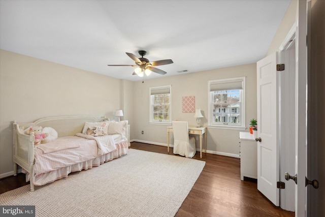 bedroom with visible vents, ceiling fan, baseboards, and dark wood-style flooring