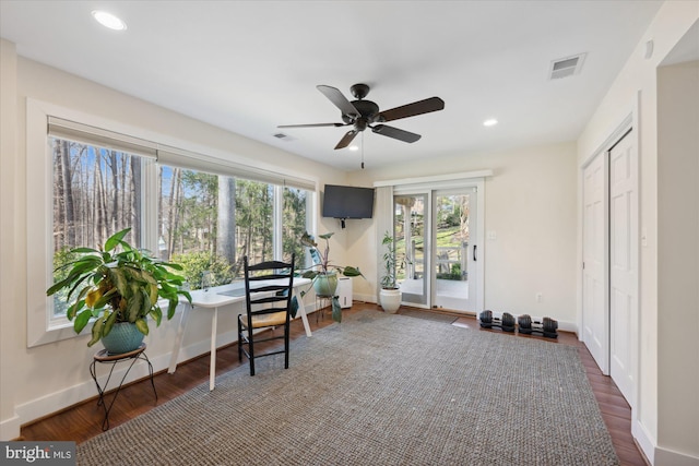 interior space featuring wood finished floors, recessed lighting, and visible vents