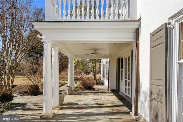 view of patio featuring french doors and a ceiling fan