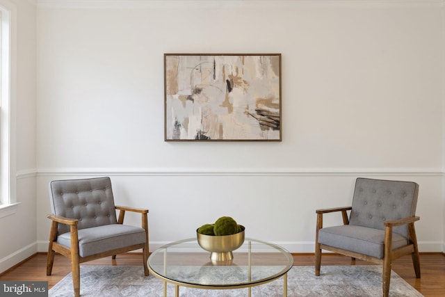 living area featuring wood finished floors and baseboards