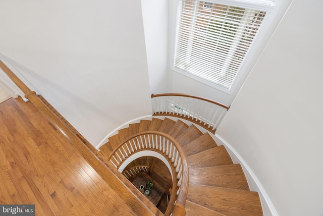 staircase featuring baseboards