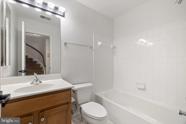 bathroom featuring toilet, washtub / shower combination, vanity, and visible vents