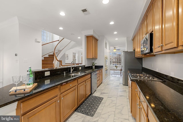 kitchen featuring marble finish floor, stainless steel appliances, recessed lighting, visible vents, and a sink