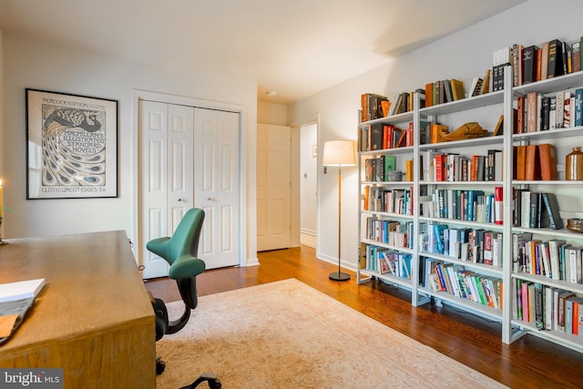 home office with wood finished floors