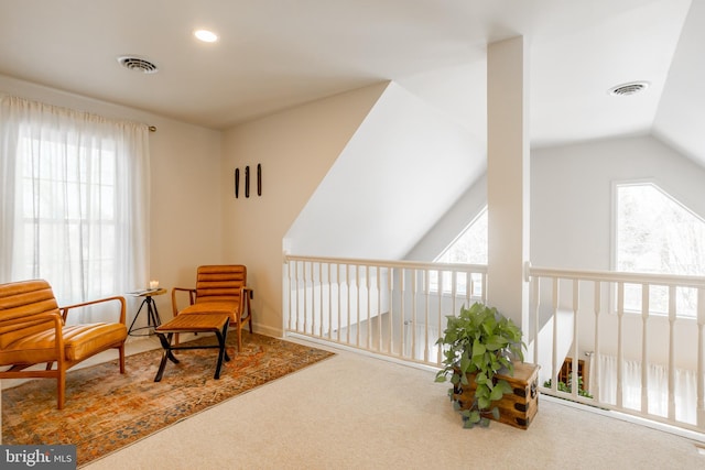 living area with vaulted ceiling, recessed lighting, carpet, and visible vents