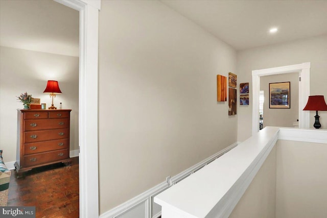 hallway featuring baseboards