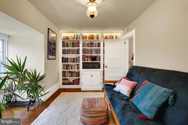 living area featuring built in shelves