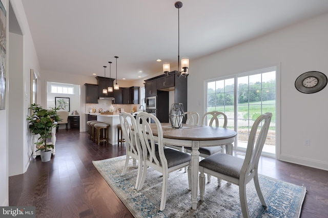 dining room featuring recessed lighting, dark wood finished floors, and baseboards