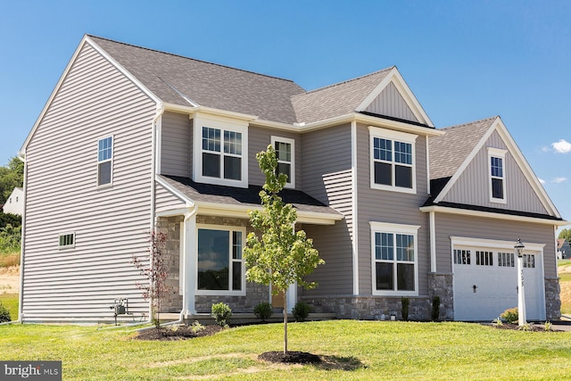 craftsman inspired home featuring a garage, a front yard, stone siding, and roof with shingles