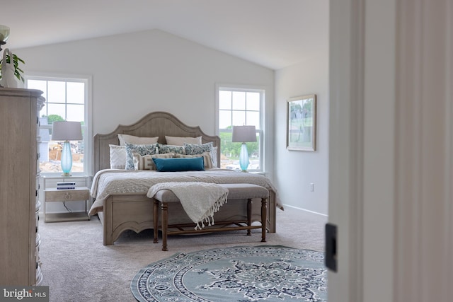 bedroom featuring carpet flooring, vaulted ceiling, and baseboards