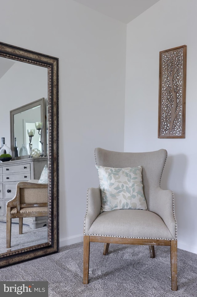 sitting room with carpet and baseboards