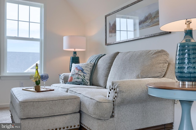 living room featuring carpet and baseboards