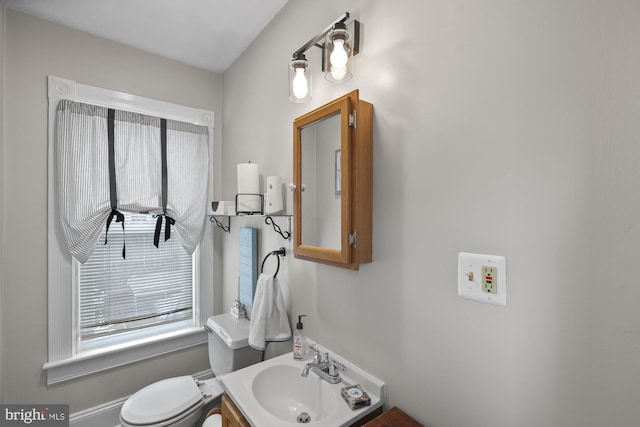 bathroom featuring toilet and a sink