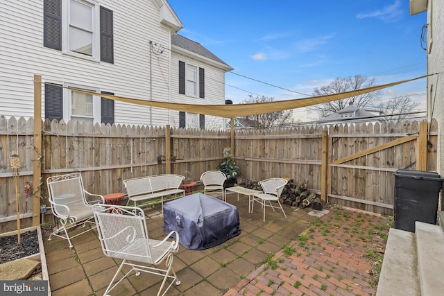 view of patio / terrace featuring fence