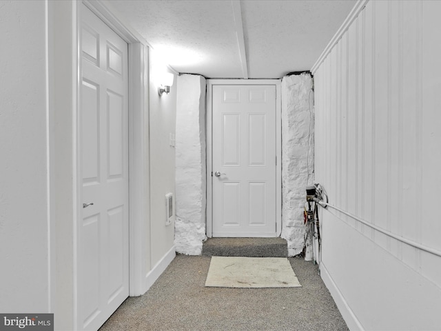 interior space with visible vents and a textured ceiling