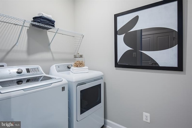 laundry area featuring laundry area and washer and clothes dryer