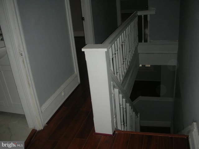 stairs with wood finished floors