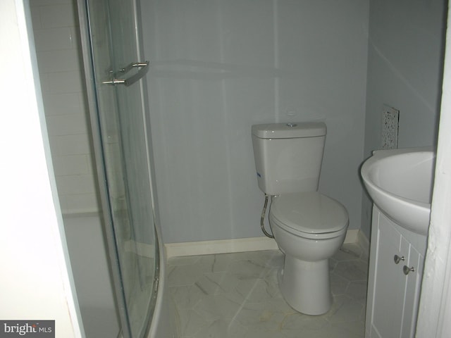 full bath featuring a shower, marble finish floor, toilet, vanity, and baseboards